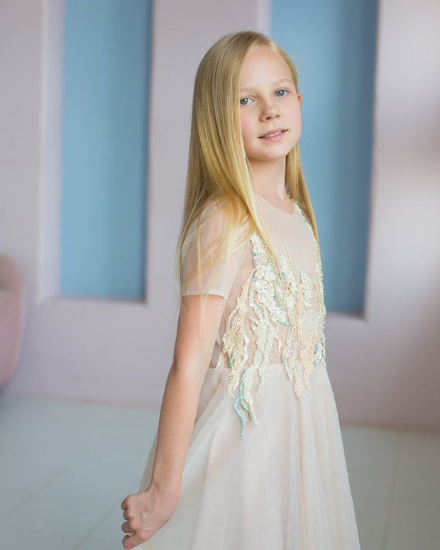 handmade, elegant girl dress with an a-line silhouette, midi length tulle skirt, floral embroidery and short sleeves in soft pastel colours, for flower girls dresses, weddings, birthdays, eid and other special occasions.