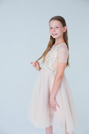 handmade, elegant girl dress with an a-line silhouette, midi length tulle skirt, floral embroidery and short sleeves in soft pastel colours, for flower girls dresses, weddings, birthdays, eid and other special occasions.