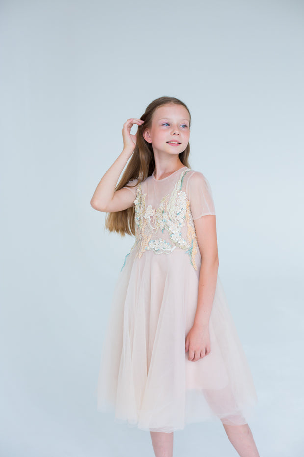 handmade, elegant girl dress with an a-line silhouette, midi length tulle skirt, floral embroidery and short sleeves in soft pastel colours, for flower girls dresses, weddings, birthdays, eid and other special occasions.