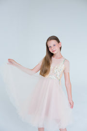 handmade, elegant girl dress with an a-line silhouette, midi length tulle skirt, floral embroidery and short sleeves in soft pastel colours, for flower girls dresses, weddings, birthdays, eid and other special occasions.