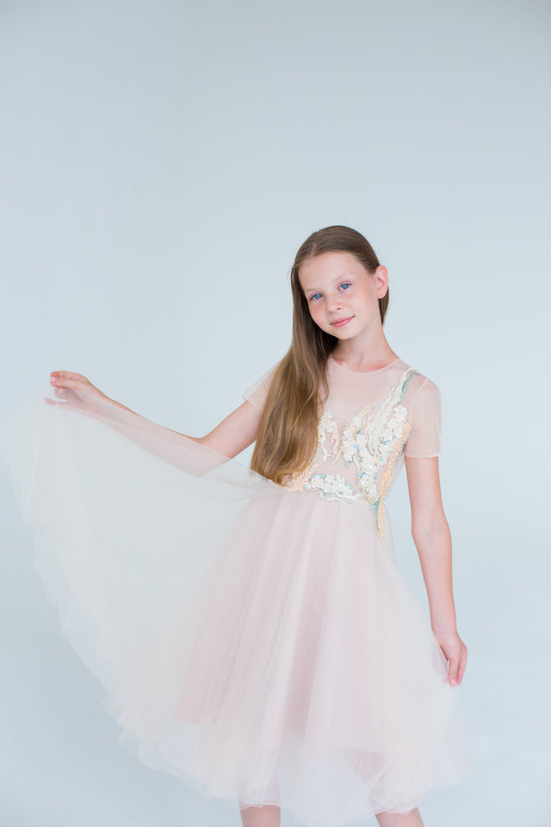 handmade, elegant girl dress with an a-line silhouette, midi length tulle skirt, floral embroidery and short sleeves in soft pastel colours, for flower girls dresses, weddings, birthdays, eid and other special occasions.