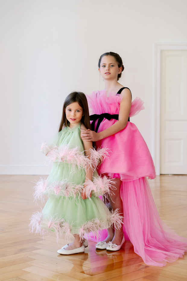 Festive bright green dress for girls with pink feather appliqués