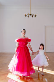 Festive, floor length princess ball gown in bright pink, with a long, voluminous tulle skirt, satin top with embroidery and off-the-shoulder neckline with tulle ruffles and feather details. For special occasions: Christmas, New Year's Eve, Wedding, Birthday party, Prom, Flower girl, Eid, and other events.