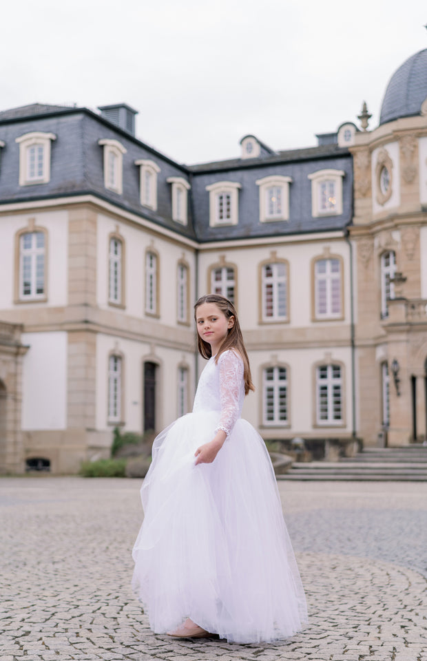 Long, a-line tulle first communion dress in white with long tulle skirt, floral lace top, high neckline and long transparent lace sleeves. Handmade with love. Occasions: First Communion, Flower girl, Wedding, Birthday party, and other events. 