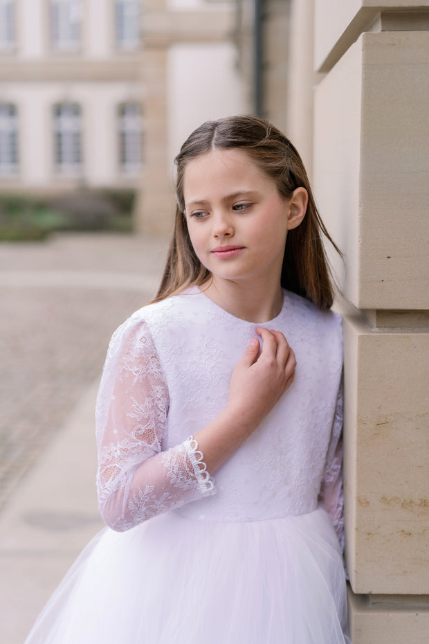 Long, a-line tulle first communion dress in white with long tulle skirt, floral lace top, high neckline and long transparent lace sleeves. Handmade with love. Occasions: First Communion, Flower girl, Wedding, Birthday party, and other events. 