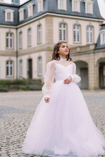 Long, a-line first communion tulle dress in white with long tulle skirt, floral lace top, high collar and long transparent sleeves. Handmade with love. Occasions: First Communion, Flower girl, Wedding, Birthday party, and other events.