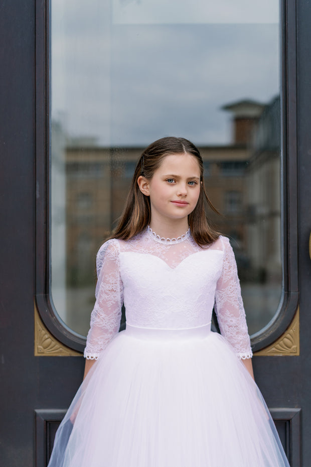 Long, a-line first communion tulle dress in white with long tulle skirt, floral lace top, high collar and 3/4 long transparent sleeves. Handmade with love. Occasions: First Communion, Flower girl, Wedding, Birthday party, and other events. 