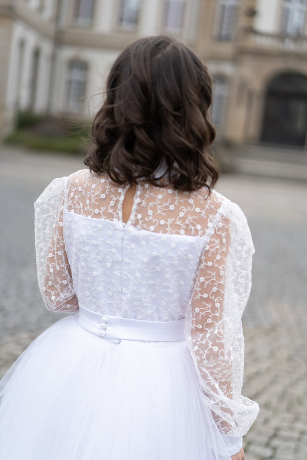 Long, a-line first communion tulle dress in white with long tulle skirt, floral lace top, high collar and long transparent sleeves. Handmade with love. Occasions: First Communion, Flower girl, Wedding, Birthday party, and other events.