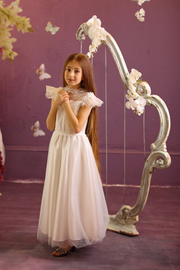 Handmade white ankle-length girl dress for first communion with a-line tulle skirt, transparent tulle details, ruffles, pearls and cap sleeves. Girl dress for special occasions. Flower girl dress, first communion dress.