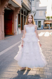 Enchanting fairy tale princess look with a long, white ball gown with voluminous skirt with tulle ruffles and open back. Occasions: Wedding, Birthday party, Prom, Flower girl, Eid, and other events.