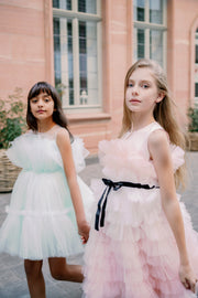 Midi length princess girl dress with ombre effect in white and pink with a ruffled tulle skirt and contrasting black ribbon at the waistline. For special occasions: Wedding, Birthday party, Prom, Flower girl, Eid, and other events.