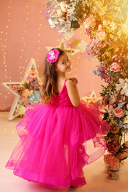 Festive bright pink girl dress with high-low hem, long tulle train and floral embroidery. The dress is for holiday season, Christmas, New Year, weddings, Eid, birthdays, parties, flower girls and other special formal events and occasions.