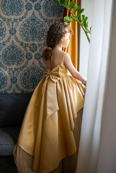 Handmade, festive, girl party dress with a high-low hem, satin train, tulle skirt, floral embroidery and a big satin bow