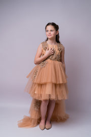 High-low hemline girl princess in a gold brown colour, with a tulle skirt, long tulle train, satin top with gold floral embroidery. For special occasions: Wedding, Birthday party, Prom, Flower girl, Eid, and other events.