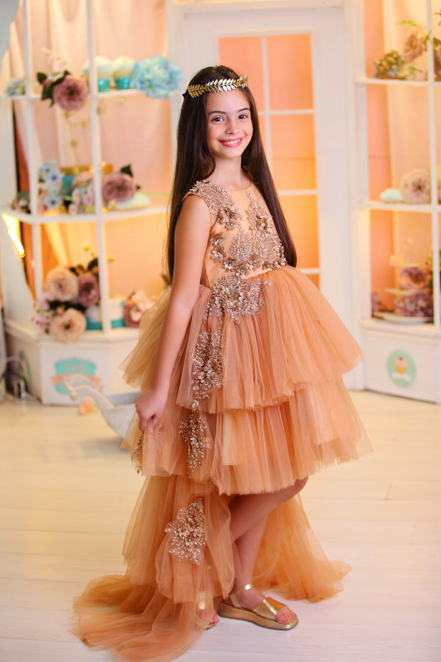 High-low hemline girl princess in a gold brown colour, with a tulle skirt, long tulle train, satin top with gold floral embroidery. For special occasions: Wedding, Birthday party, Prom, Flower girl, Eid, and other events.