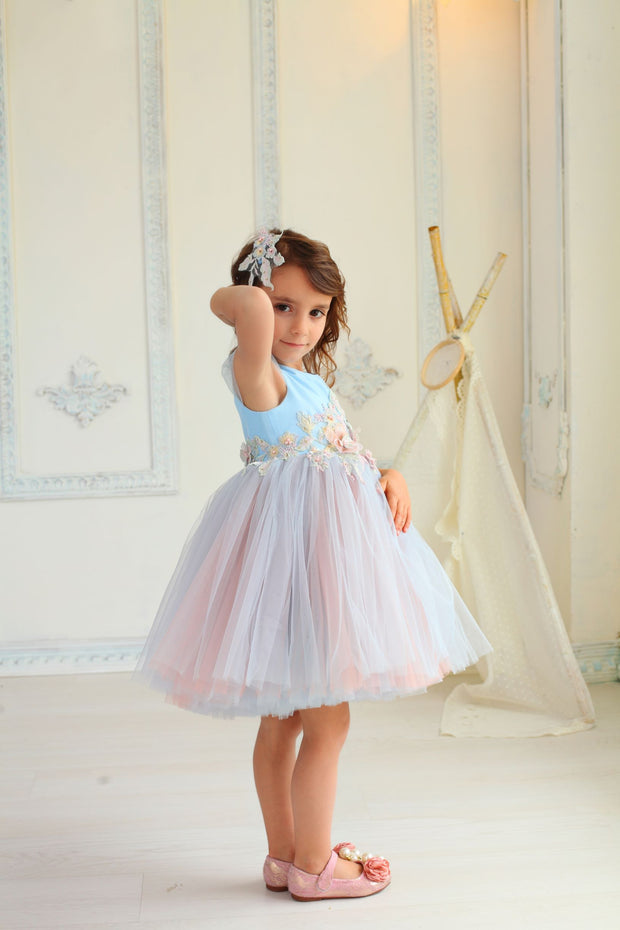 beautiful girl dress with blue and pink tulle skirt decorated by waistline floral embellishment 