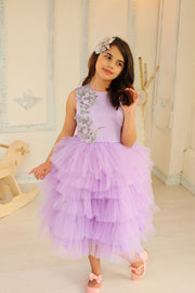 little girl dresses up in purple dress for special occasion