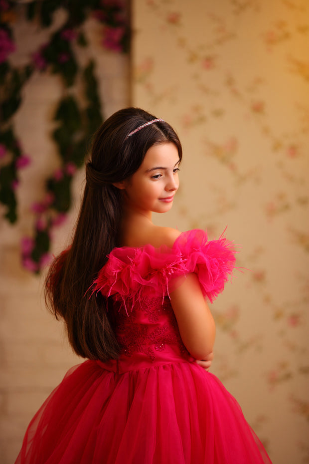 Floor length princess ball gown in bright pink, with a long, voluminous tulle skirt, satin top with embroidery and off-the-shoulder neckline with tulle ruffles and feather details. For special occasions: Wedding, Birthday party, Prom, Flower girl, Eid, and other events.