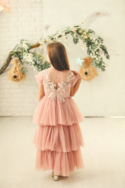 Ankle-length princess dress in a baby pink color with multi-layered tulle skirt, transparent ruffled sleeves and floral embroidery on the front and back satin bodice. Girl dress for special occasions: flower girls, weddings, birthday party, communion, Eid.