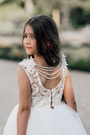 Enchanting princess dress in white with a voluminous, long tulle skirt,satin top with intricate lace embroidery, open back and pearl details.