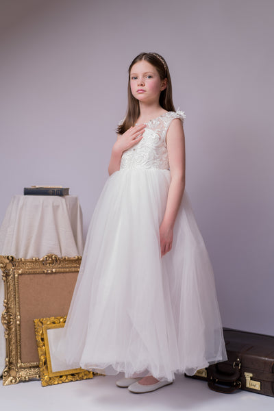 Enchanting princess dress in white with a voluminous, long tulle skirt,satin top with intricate lace embroidery, open back and pearl details.