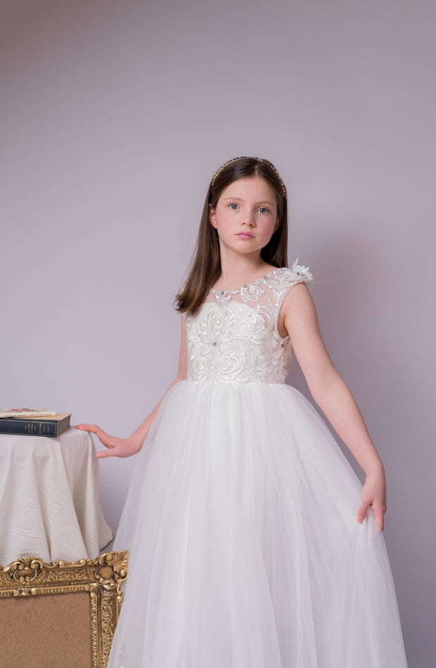 Enchanting princess dress in white with a voluminous, long tulle skirt,satin top with intricate lace embroidery, open back and pearl details.