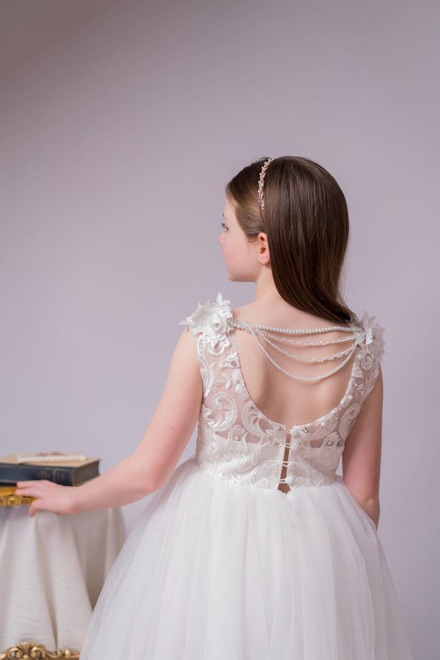 Enchanting princess dress in white with a voluminous, long tulle skirt,satin top with intricate lace embroidery, open back and pearl details.