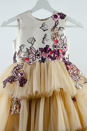 handmade long beige princess girl dress with a multi-layered asymmetrical tulle skirt and pink and red embroidery and sequins