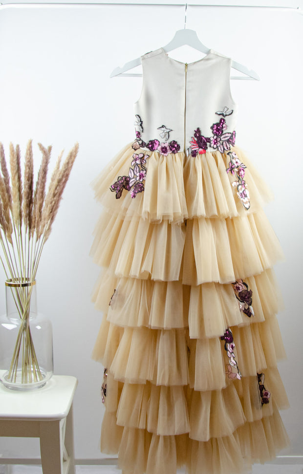 handmade long beige princess girl dress with a multi-layered asymmetrical tulle skirt and pink and red embroidery and sequins