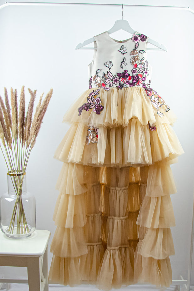 handmade long beige princess girl dress with a multi-layered asymmetrical tulle skirt and pink and red embroidery and sequins