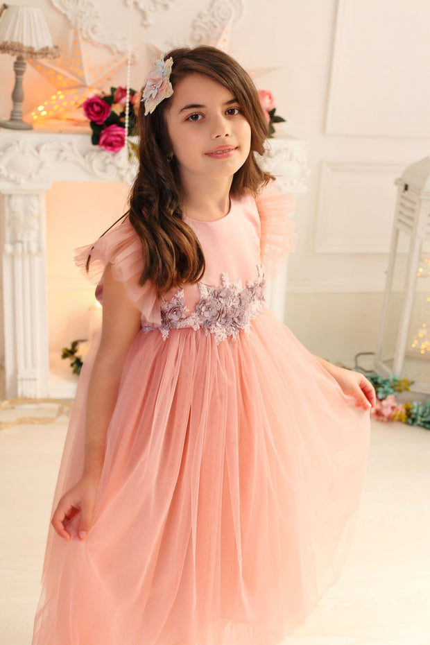 pastel pink little girl dress with multi-layer tulle skirt and floral embellishment for birthday parties and special occasions