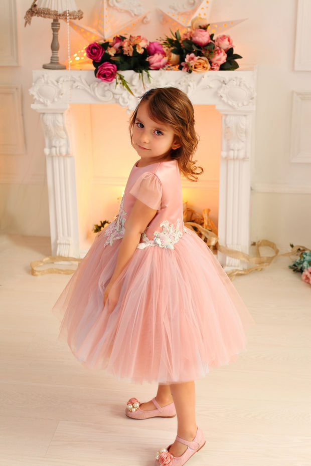 pastel pink little girl dress with multi-layer tulle skirt and floral embellishment for birthday parties and special occasions