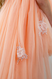 Peach princess dress with a high low skirt and floral embellishments. Perfect for any spring or summer ocassion: weddings, flower girls dress, communion, birthday party, Eid