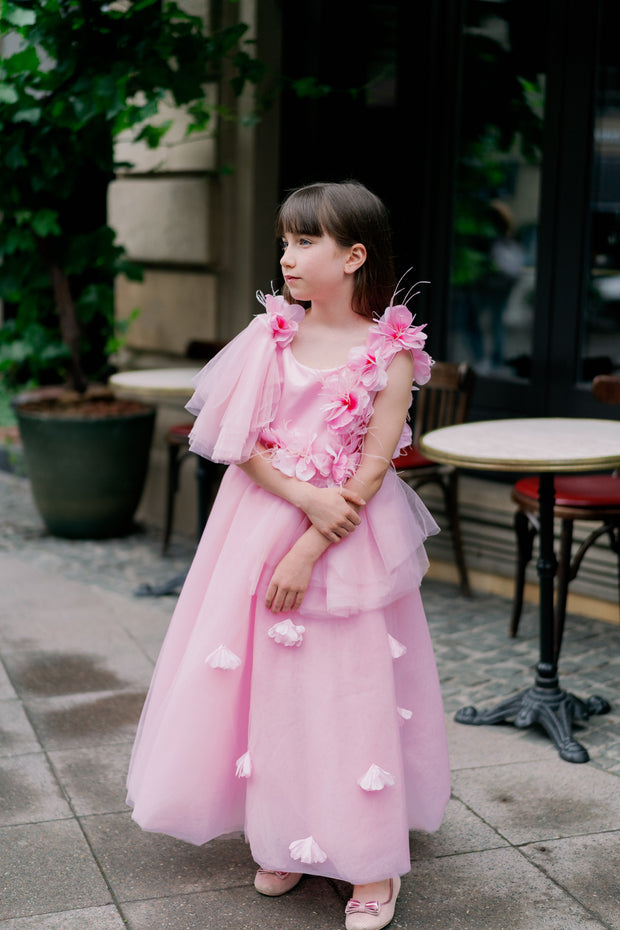 Long pink princess girl dress with a long tulle skirt, asymmetrical sleeves and all-over 3D flower embellishments. For special occasions: flower girls, weddings, Eid, princess birthday party.