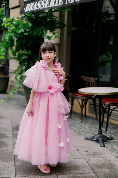 Long pink princess girl dress with a long tulle skirt, asymmetrical sleeves and all-over 3D flower embellishments. For special occasions: flower girls, weddings, Eid, princess birthday party.