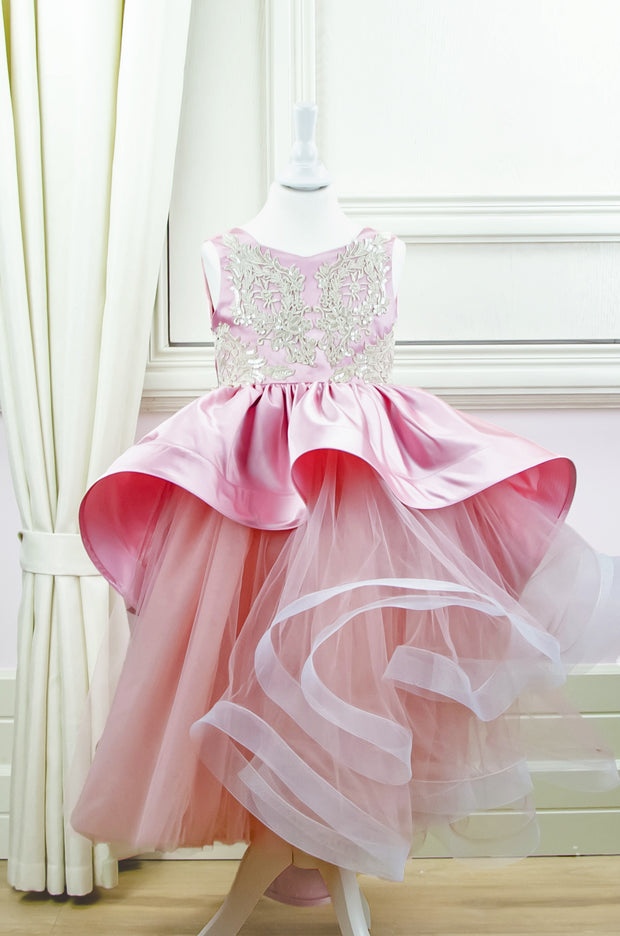 Handmade asymmetrical pink flower girl dress with multi-layer tulle skirt, satin overlay, satin train and gold lace embroidery, for flower girls, weddings, birthdays.