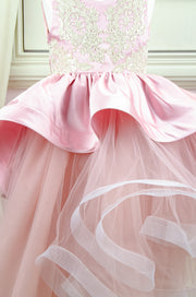 Handmade asymmetrical pink flower girl dress with multi-layer tulle skirt, satin overlay, satin train and gold lace embroidery, for flower girls, weddings, birthdays.