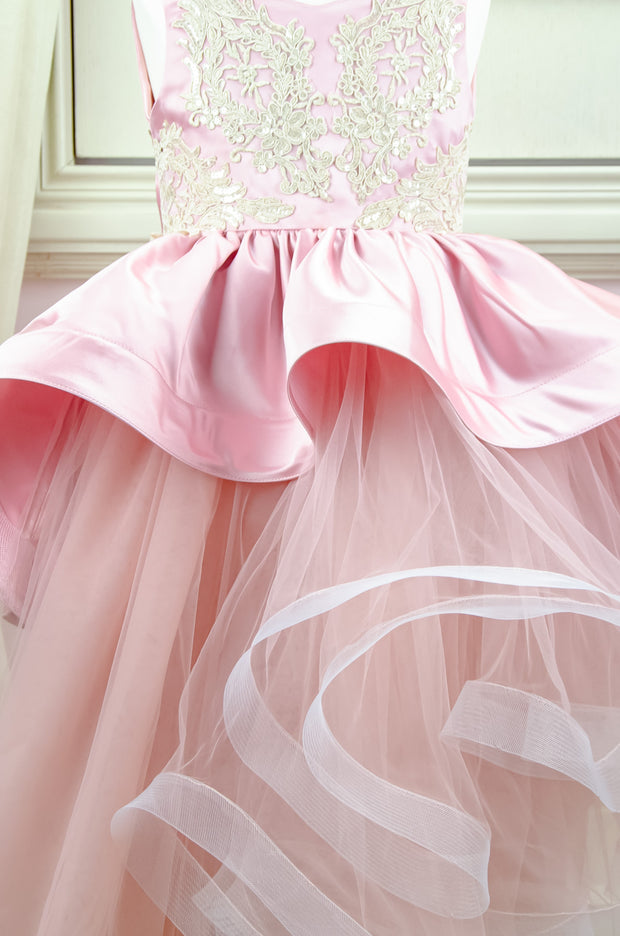 Handmade asymmetrical pink flower girl dress with multi-layer tulle skirt, satin overlay, satin train and gold lace embroidery, for flower girls, weddings, birthdays.