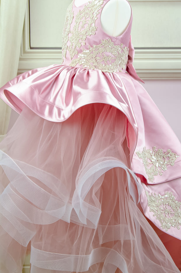 Handmade asymmetrical pink flower girl dress with multi-layer tulle skirt, satin overlay, satin train and gold lace embroidery, for flower girls, weddings, birthdays.