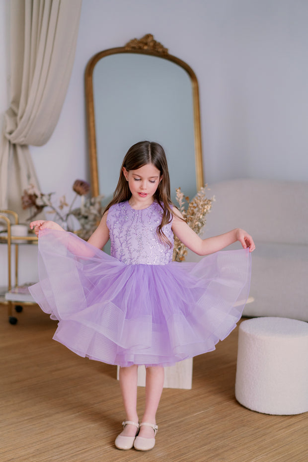 Knee-length flower girl tutu dress with a voluminous tulle skirt, satin sleeveless top and purple sequin embellishment. Handmade with love. For special occasions: Wedding, Birthday party, Prom, Flower girl, Eid, and other events.