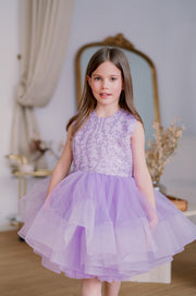 Knee-length flower girl tutu dress with a voluminous tulle skirt, satin sleeveless top and purple sequin embellishment. Handmade with love. For special occasions: Wedding, Birthday party, Prom, Flower girl, Eid, and other events.