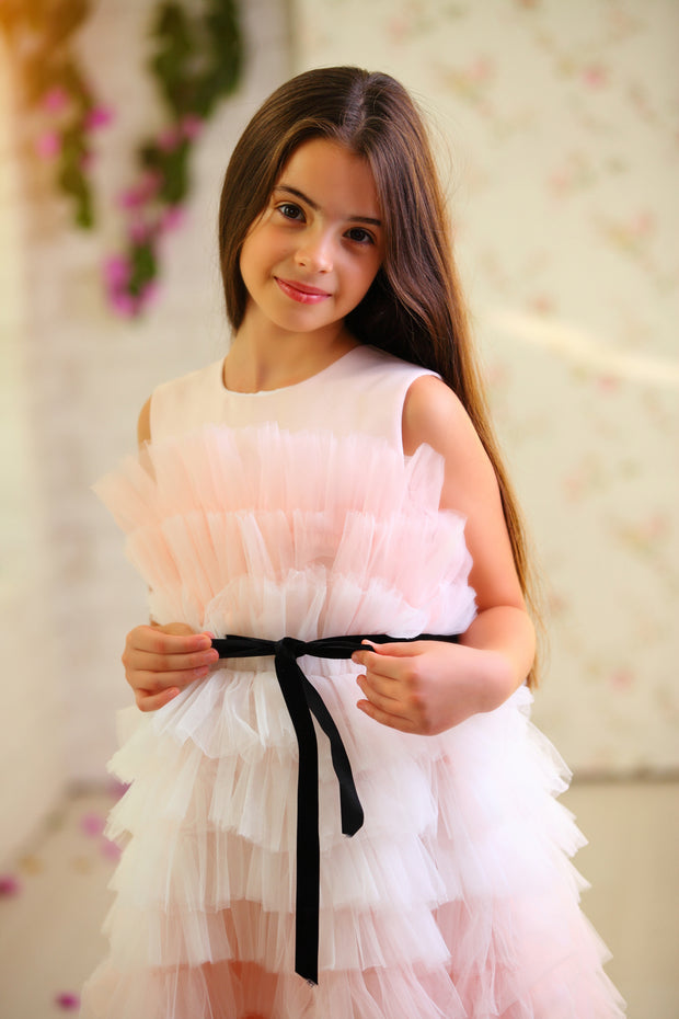 Midi length princess girl dress with ombre effect in white and pink with a ruffled tulle skirt and contrasting black ribbon at the waistline. For special occasions: Wedding, Birthday party, Prom, Flower girl, Eid, and other events.