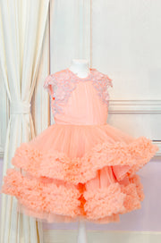 Knee-length multi-layered tulle princess girl dress in a bright salmon colour perfect your spring and summer special occasions: flower girls, weddings, birthday.