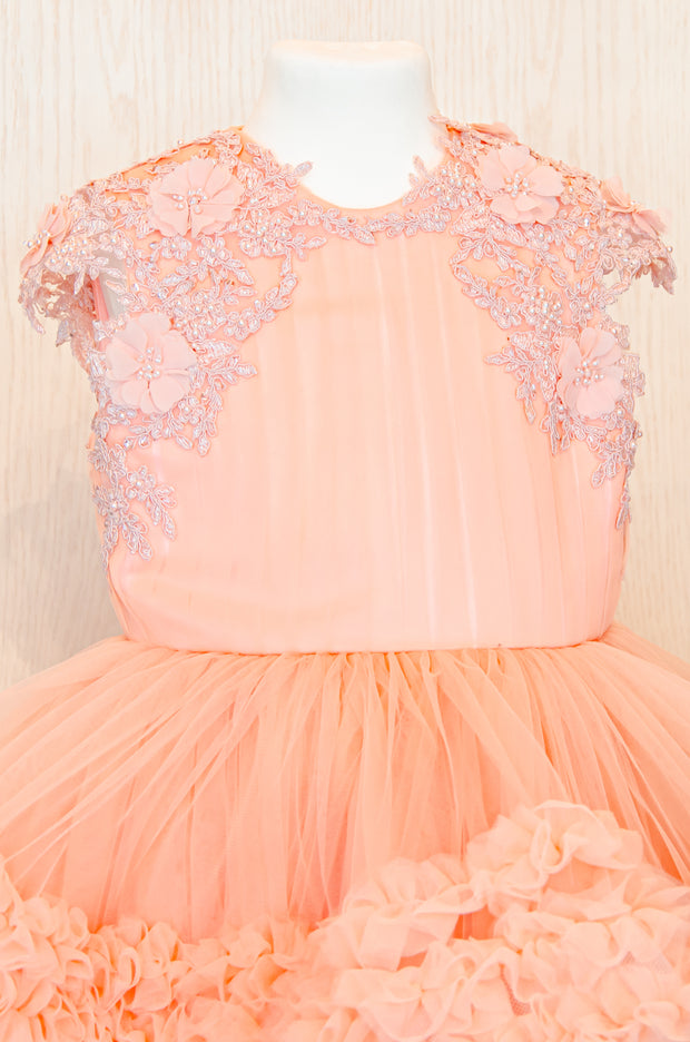 Knee-length multi-layered tulle princess girl dress in a bright salmon colour perfect your spring and summer special occasions: flower girls, weddings, birthday.
