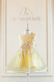 handmade short A-line yellow flower girl dress with a short tulle skirt and hand embroidered top with pastel flowers, pearls and rhinestones