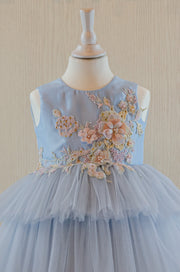 pastel blue girl dress with floral embellishment