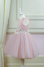 pastel pink little girl dress with multi-layer tulle skirt and floral embellishment for birthday parties and special occasions