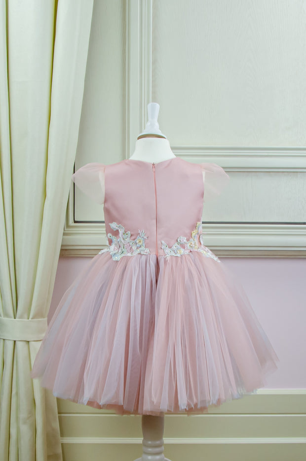 pastel pink little girl dress with multi-layer tulle skirt and floral embellishment for birthday parties and special occasions