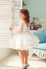 Short white flower girl dress with a multi-layer tutu skirt, transparent sleeves and 3D floral embroidery in gold. The dress is for weddings, birthdays, parties, flower girls and other special formal events and occasions.