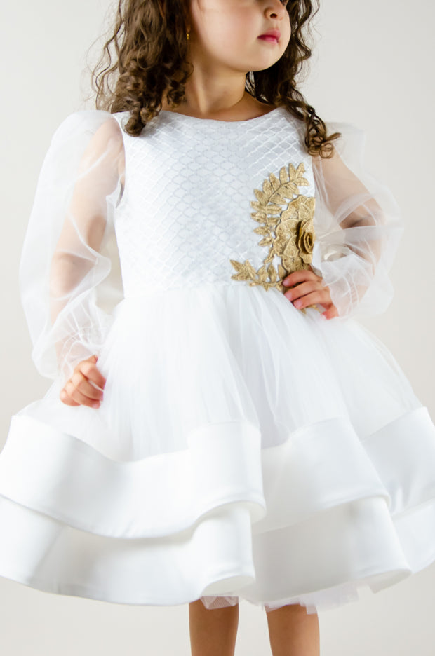 Handmade short white flower girl's dress with a multi-layered tutu skirt, golden embroidery and a big bow on the back